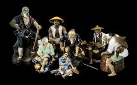 Collection of Seven Chinese Mud Figures, doing various tasks, woodcutter, fisherman, etc.