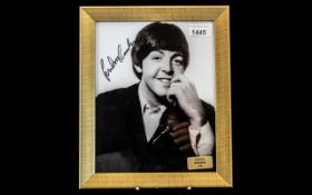 Beatles Interest - Signed Photograph of Paul McCartney, framed behind glass, with a ''Famous