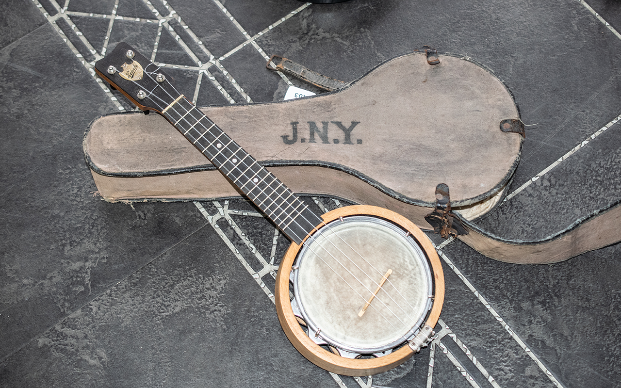 Keech Ukulele Banjo, closed back, in canvas case, overall length 21.75".