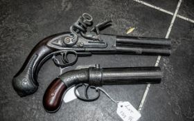 Two Replica Pistols To Include a Double Flintlock And A Pepperbox Style Pistol.