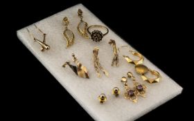 Small Collection of Gold Items, to include seven pairs of earrings, and a 9ct garnet ring.