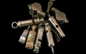 A Collection of Eight Whistles, to include two Harps 1941 Military, a Liverpool City Police Whistle,