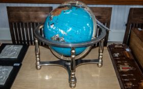 Lapis Gemstone Globe, set with gemstones, mounted on steel tripod stand, with four legs.