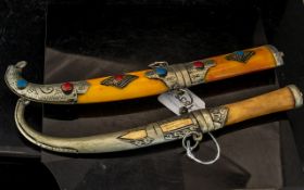 Two Islamic Knives in decorative sheaths, made for the tourist office.