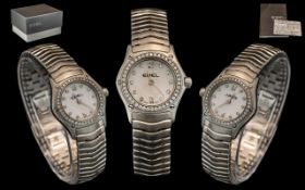 Ladies Ebel Classic Wave Stainless Steel Wristwatch white dial with a diamond bezel,