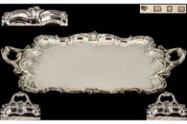 A Large & Impressive Double Handled Robust Silver Serving Tray, with a finely cast Rococo swept