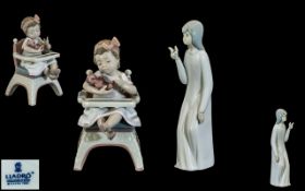 Lladro Figure no. 6299 'Little Bear' depicting a young girl sat in a high chair holding a teddy