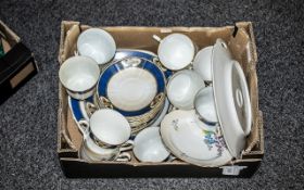 Two Porcelain Tea Sets, comprising Staffordshire New Chelsea 'Alicia' set of six cups,