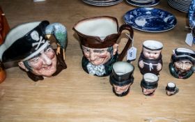 Collection of Seven Toby Jugs, comprising Royal Doulton 'Old Charley' and 'Long John Silver' No.