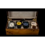 Collection of Five Fashion Watches, housed in a wooden case,