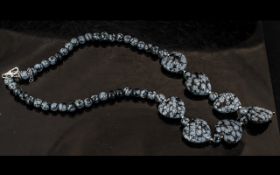 Snowflake Obsidian Pendant Necklace, comprising six heart shaped, carved and polished pieces of