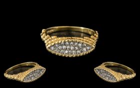 An 18ct Gold Diamond Set Dress Ring textured mount pavee set with round cut diamonds.