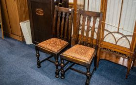 A Pair of Early 20thC Oak Dining Chairs drop in seats, turned front legs.