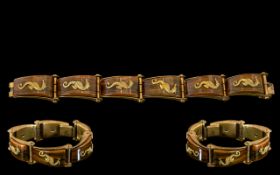 French Base Metal Designer Bracelet, applied gilt sea horses on bakelite style links,