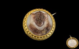 An Antique 15ct Gold Egyptian Revival Brooch. Mother of pearl cameo Sphinx in an unmarked 15ct