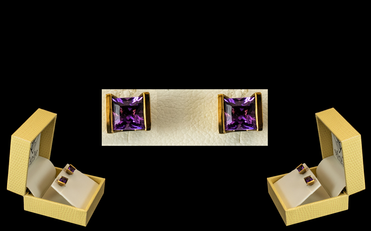 Ladies 9ct Gold Pair of Attractive Princess Cut Amethyst Set Earrings. Marked 9.375.