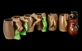 Collection of Six Japanese Mugs, the handles in the form of naked ladies in various poses,