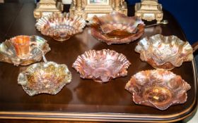 Collection of Carnival Glass, comprising eight assorted fluted bowls, approx 9" diameter,