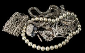 A Collection of Costume Jewellery to include bangles, silver rings, pendants and chains,