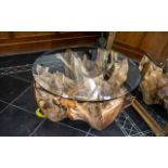 Root Wood Glass Top Coffee Table, of modern abstract form.