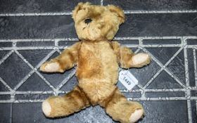 Mohair Early 20th Century Jointed Teddy Bear, straw filled. Length 12". One glass eye missing.