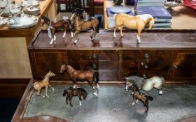 Collection of Beswick Horses, comprising three Beswick foals, two bay horses and a Bisque Palomino.