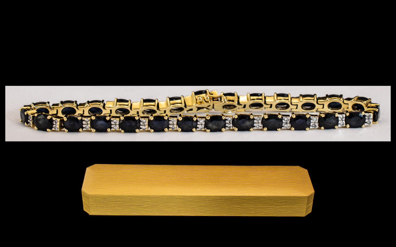 18ct Gold Sapphire and Diamond Bracelet set with alternating sapphires between two round cut