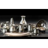 A Mixed Collection of Mostly Pewter Water Jugs & Tankards, together with two Keswick style dishes.