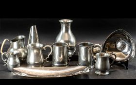 A Mixed Collection of Mostly Pewter Water Jugs & Tankards, together with two Keswick style dishes.