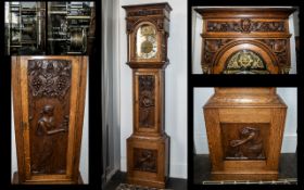 Arts & Crafts Oak Cased Long Case Clock, silver chapter dial with gilt spandrels, the oak cased