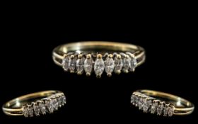 A Ladies 9ct Gold Dress Ring set with marquis cut diamonds .55 of a carat. Ring Size P - Q.