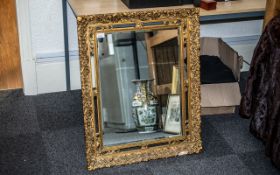 Rectangular Gilt Over the Mantel Mirror with ornate frame. Measures 31" length, 25 1/2" width.