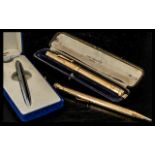 A Swan Mabie Todd & Co of London Pen gold tone engine turned barrel and cap, monogrammed PHS,