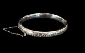 Silver Bangle with Safety Chain.