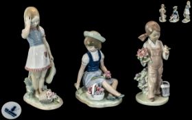 Collection of Three Lladro Figures, comprising Lladro Daisa No.1287, Girl picking wild flowers, 6.
