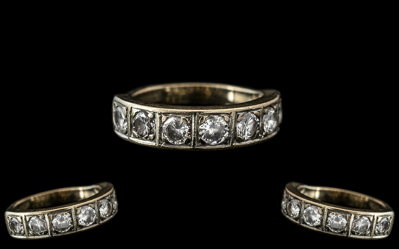 An 18ct Gold Half Eternity Ring, set wit