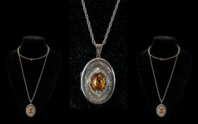 Large Silver Pendant - Suspended on a Silver Necklace. Locket of Top Quality with Large Amber