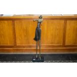 Decorative Metal Figure of a Girl Playing a Violin, set on a wooden base, measures approx. 42" tall.