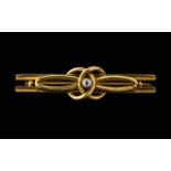 A 15ct Gold Diamond Set Brooch of Knot Form 15ct gold tab to reverse. Weighs 4.5 grams.
