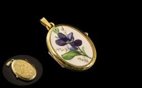 18ct Gold Locket / Pendant In Oval Form. Marked 750. With Enamel Front, Approx 9 grams.