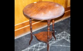 A Small Mahogany Occasional Table circular top, turned supports. 22 inches diameter, height 26