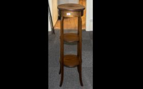 Mahogany Inlaid Three Tier Plant Stand, raised on four tapering legs,