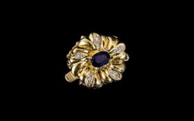 An 18ct Gold Sapphire and Diamond Set Pearl Clasp set with a central sapphire surrounded by