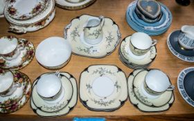 Noritake Tea Set comprising a milk jug, sugar bowl, six saucers, two cups, 6 square side plates,