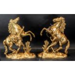 A Pair of Spelter Marley Horse and Trainers. Height 16 inches.