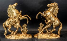 A Pair of Spelter Marley Horse and Trainers. Height 16 inches.