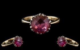 Antique Gem Set Ring, set with a faceted red stone. Unmarked, tests 9ct gold.