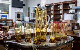 Whitefriars Amber Glass Lemonade Set, comprising 12" tall jug, with six matching 6" tumblers.