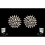 18ct White Gold Attractive Pair of Diamond Set Cluster Earrings of Circular Form. Marked 18ct - 750.