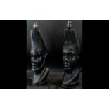 A Pair of Decorative Table Lamps in the form of African Tribal Stylised Heads both measuring 19